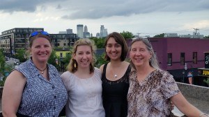 Nadine, Grace, Taylor and Katherine with the Minneapolis skyline in the background.