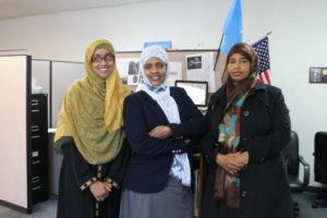 Three women in the office of Isuroon who champion health and civic engagement of their somali women and their communities in the Twin Cities.