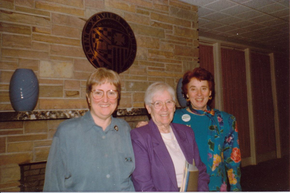 Photograph of three women.