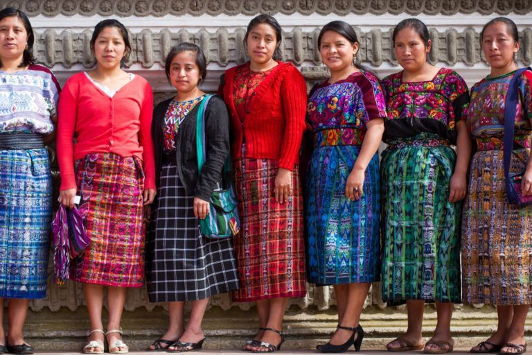 young women graduates from guatemala dressed in traditional bright patterned guatemalan dress