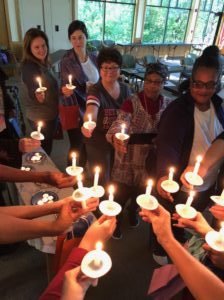 photograph of Mary's Pence grantees holding lit candles